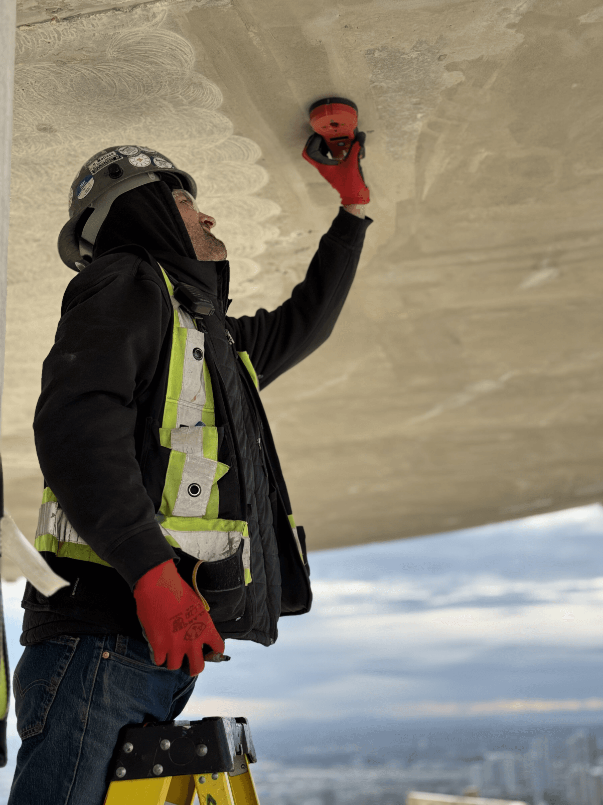 Worker transpointing an x-ray location on a concrete slab